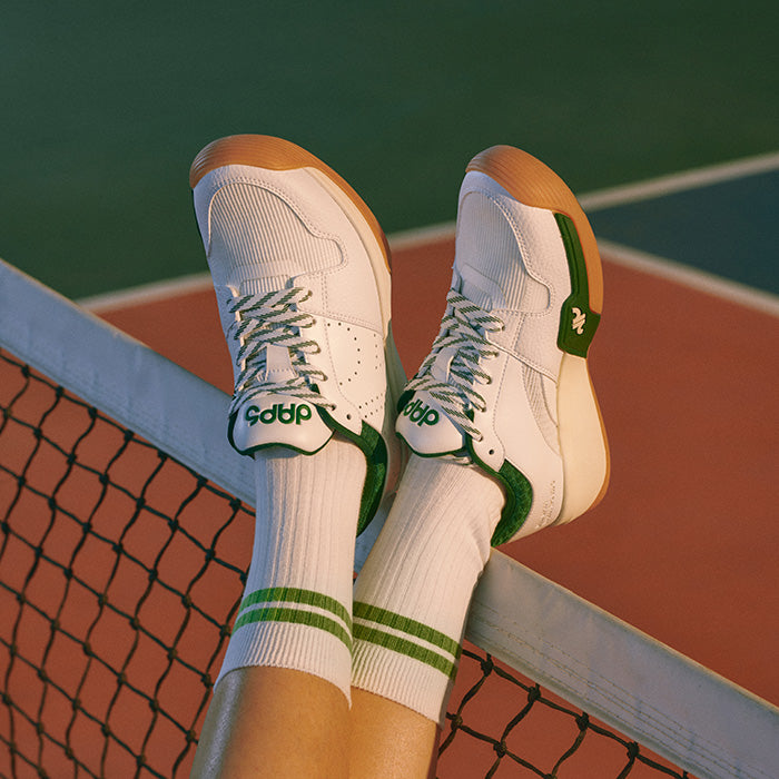 Pickleball Shoes Purpose built for Pickleball - Women's legs resting on net