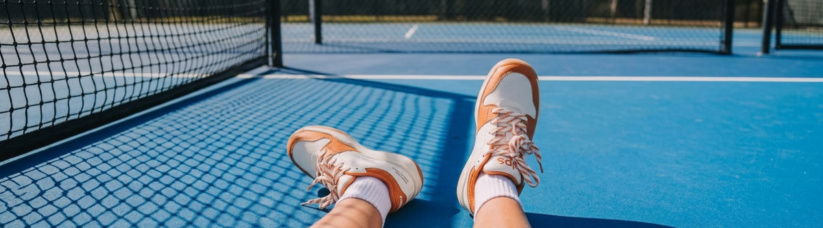 Relaxed feet up wearing pickleball court shoes