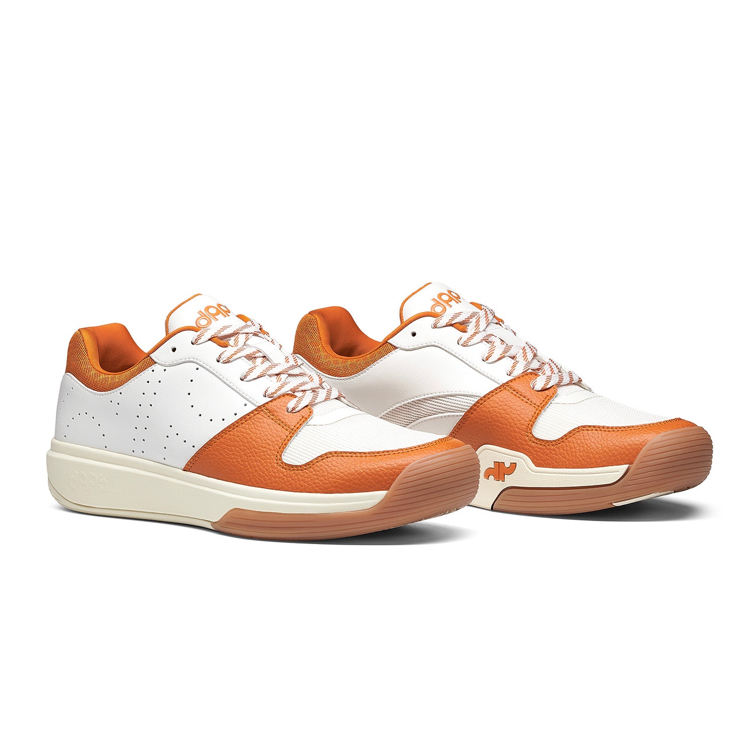 Pair of Men’s DAPS DESI Low pickleball shoes in Burnt Orange and White – lightweight, responsive design built for control and comfort.
